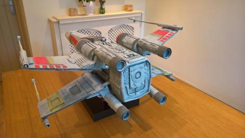 Star Wars X-Wing fighter model, which was scratch built using a variety of simple materials